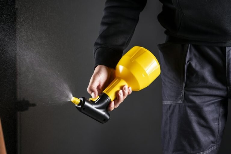 Pest control technician applying treatment